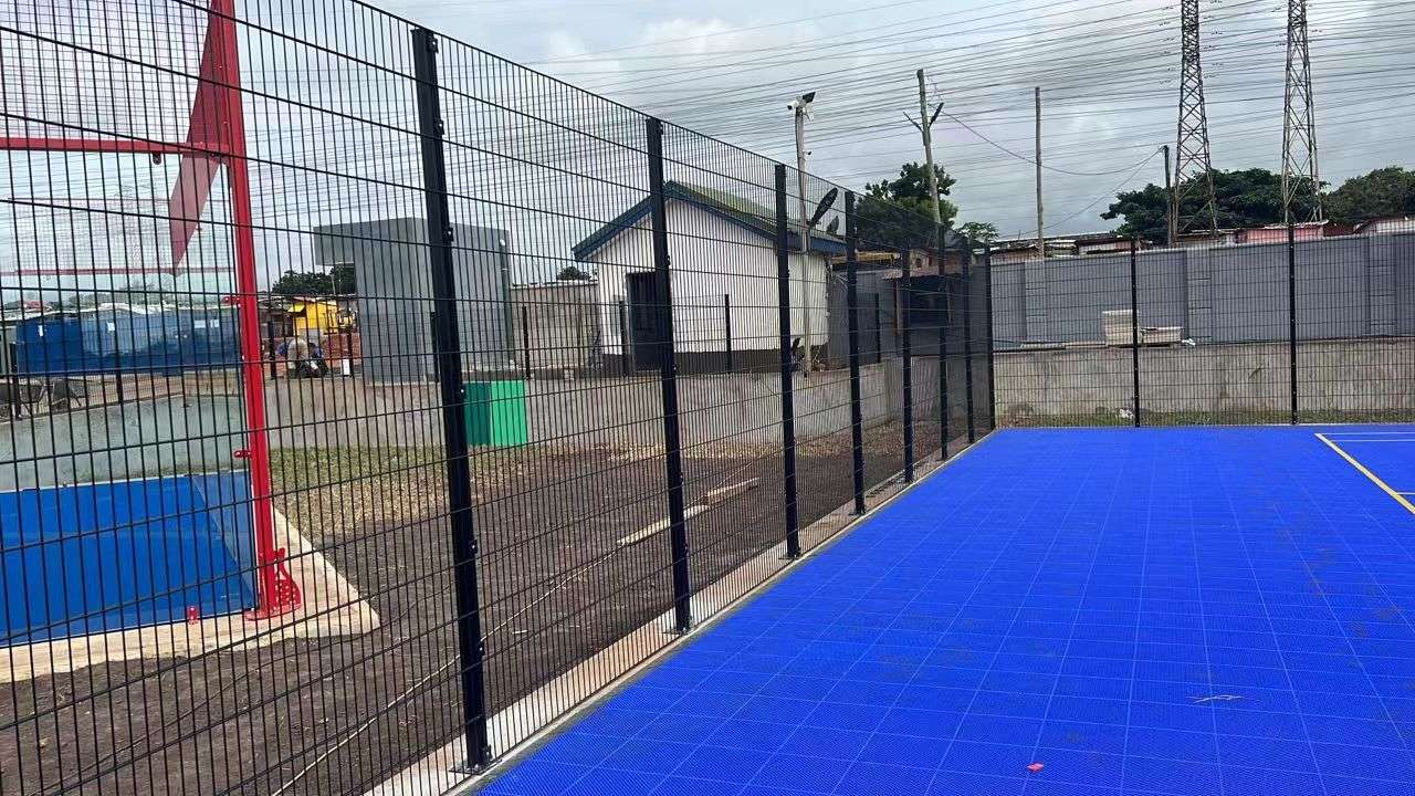 Interior view of black welded mesh sports court perimeter fencing