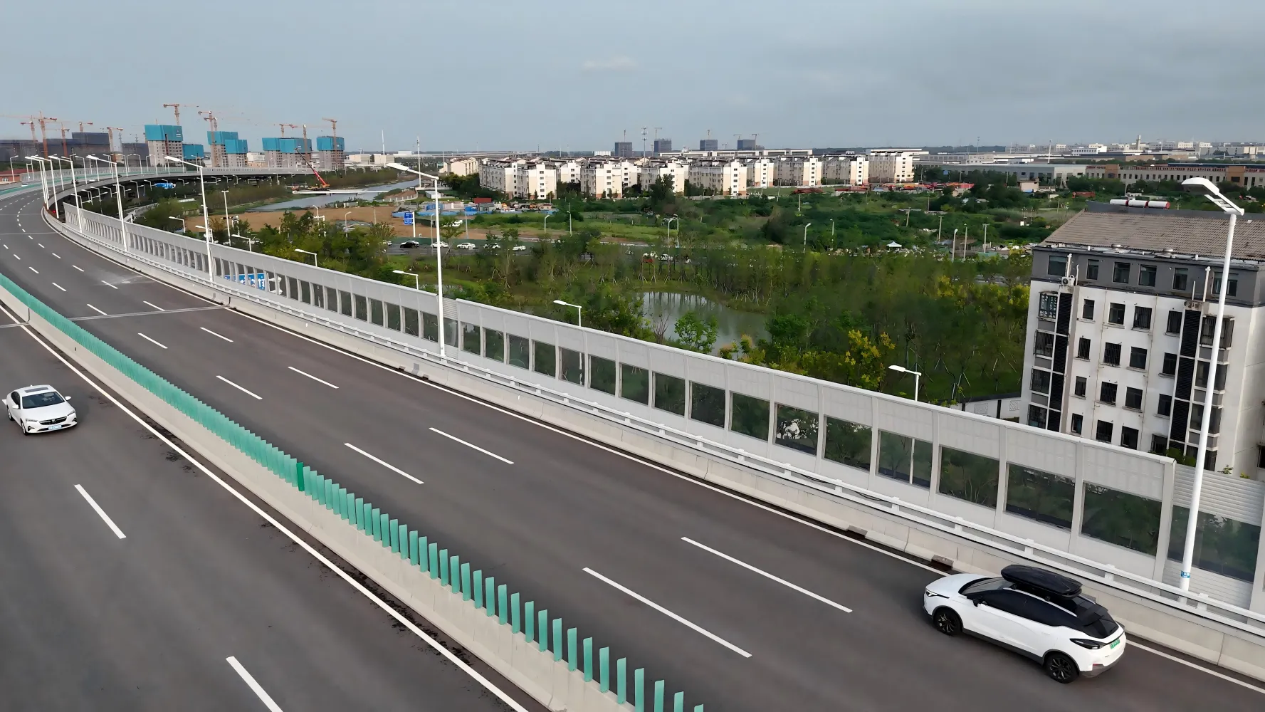Highway noise barrier installed along a busy motorway