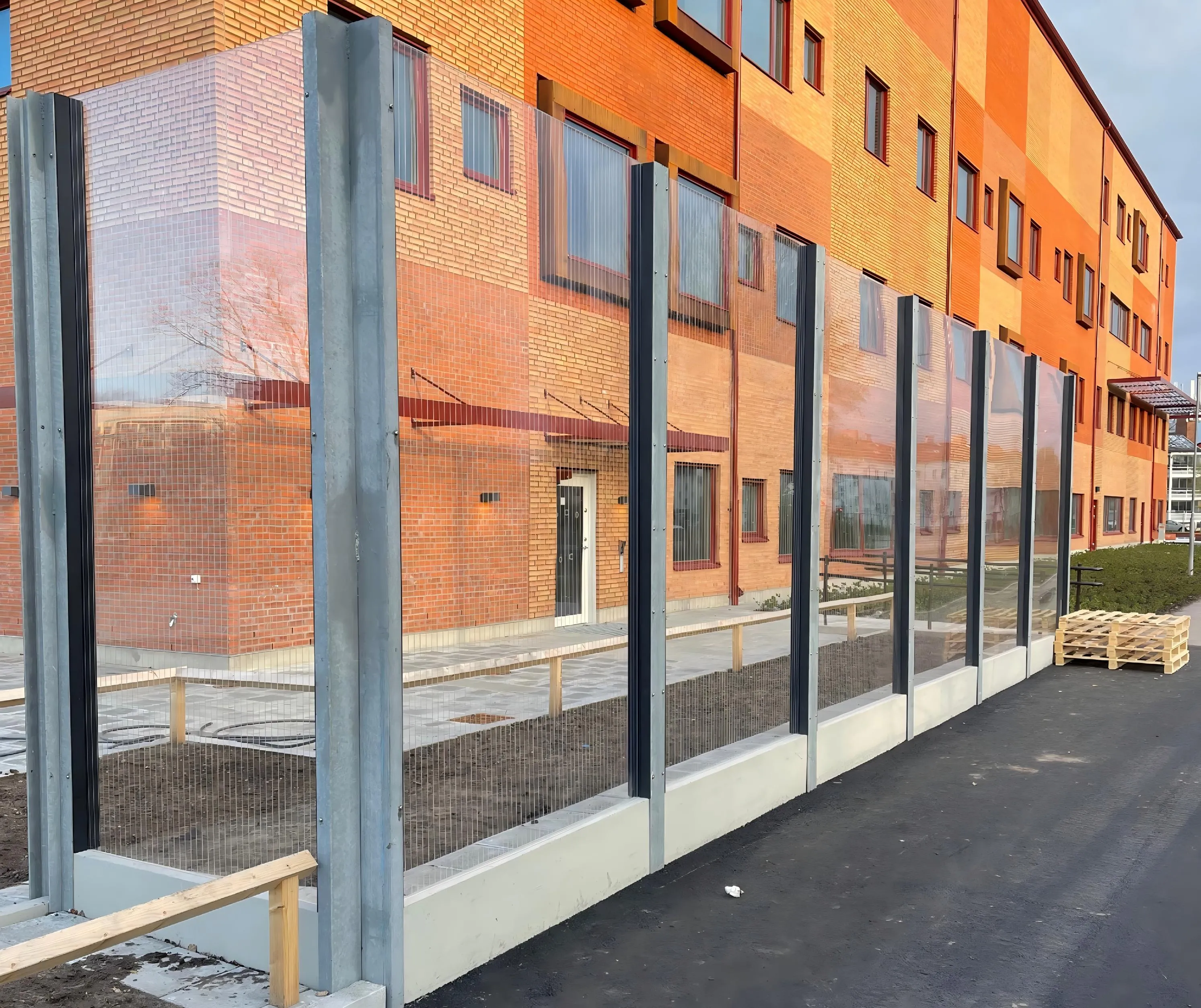 Highway noise barrier installed along a busy motorway