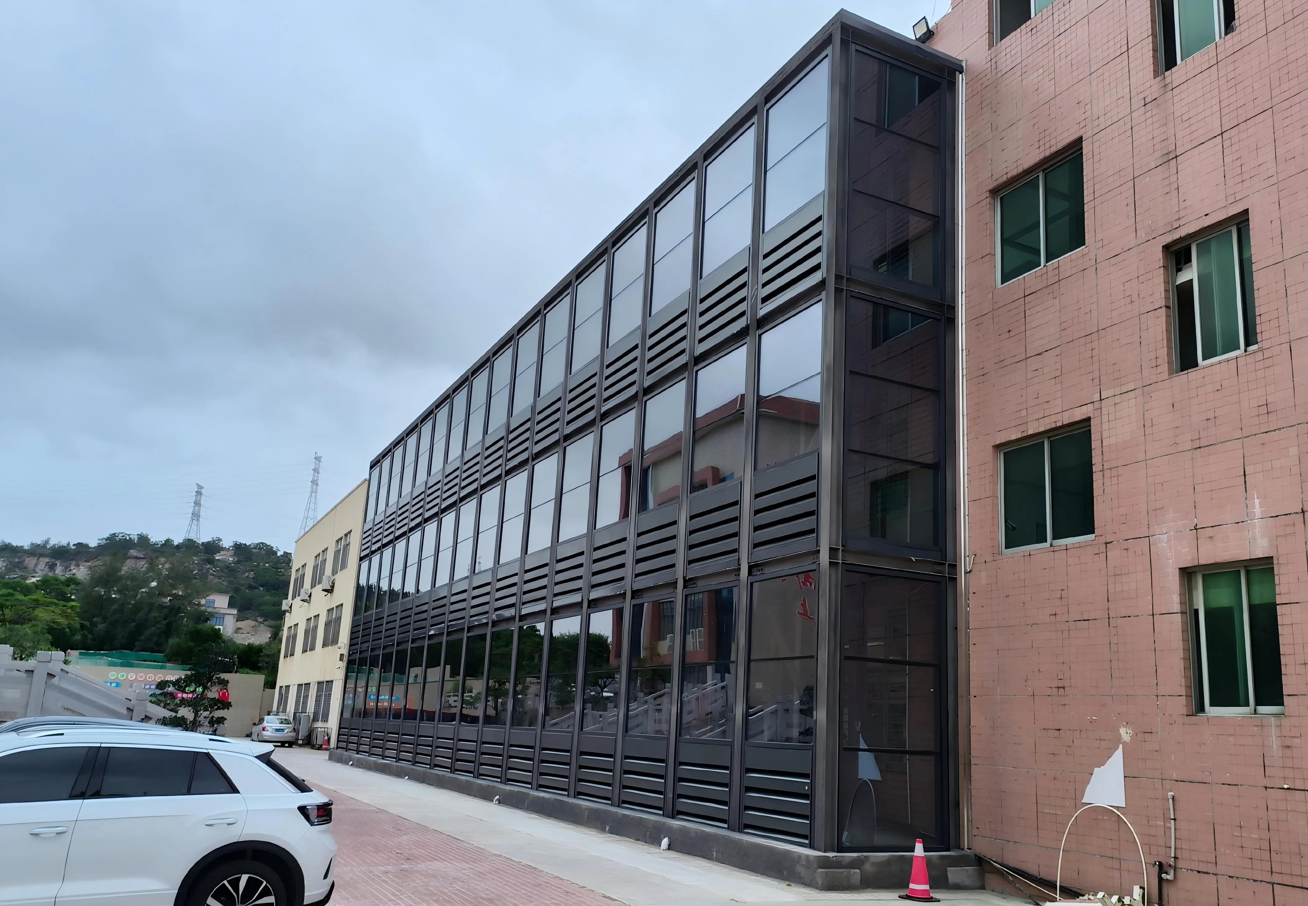 Close-up view of civil noise barrier panel showing material texture and mounting details