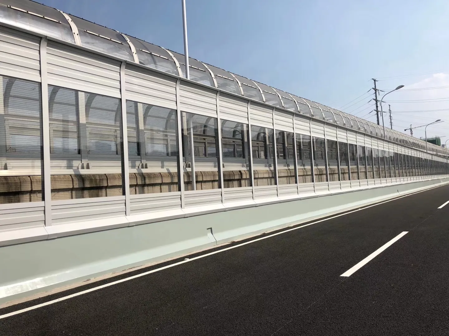 Highway noise barrier system protecting residential areas from traffic noise