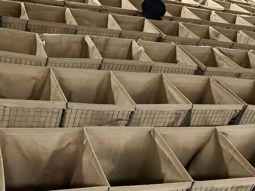 Heavy-duty wire mesh deployable barrier system filled with earth or sand