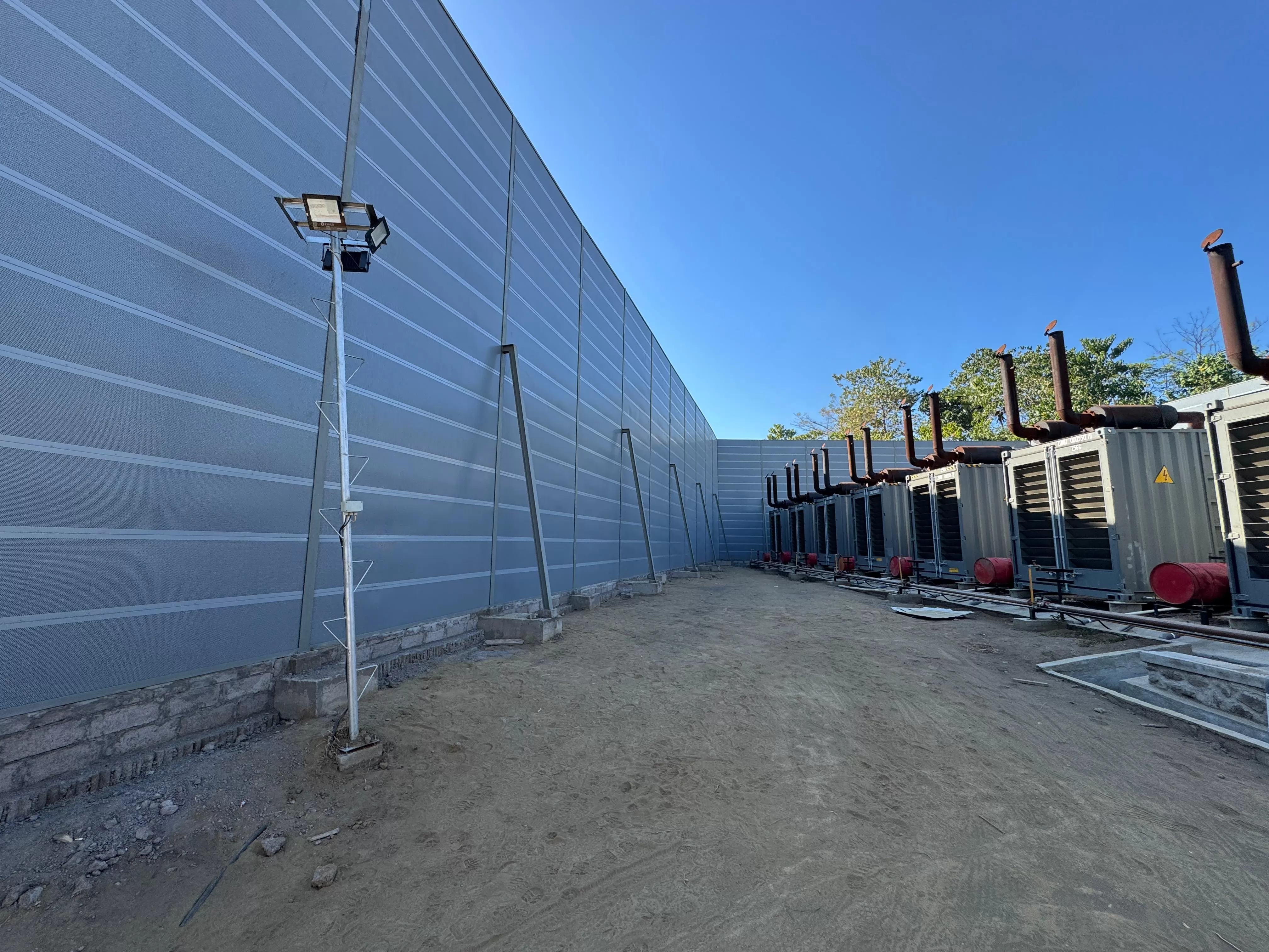 lose-up of micro-perforated metal noise barrier panels and support structure